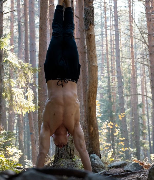 Man performing a core strength exercise in a calm, focused environment.